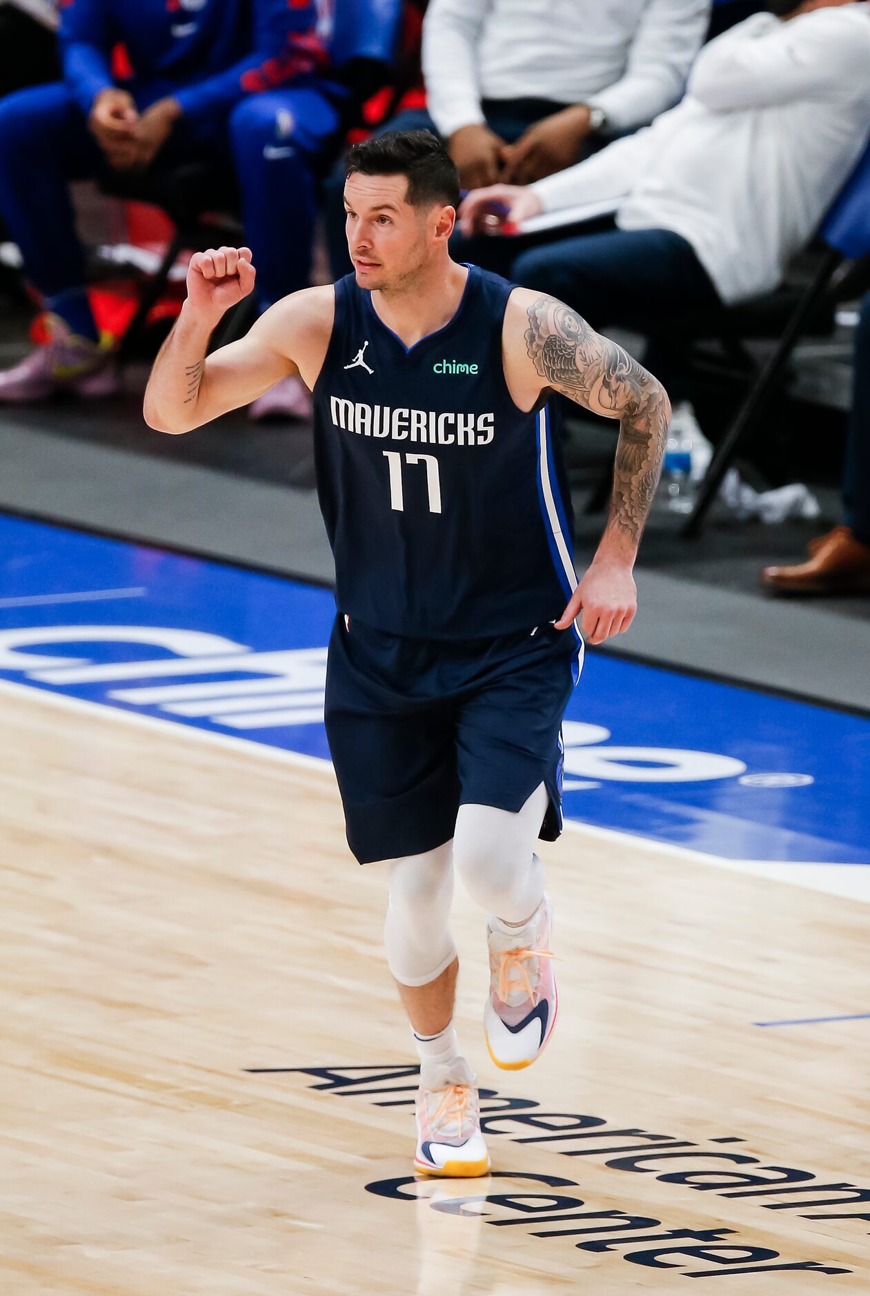 Dallas Mavericks guard JJ Redick (17) signals to his teammates during the second half of an...