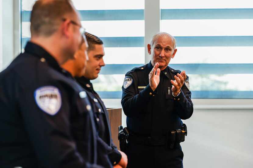 Richardson Police Department Chief Gary L. Tittle (right) swears in new officers in October,...