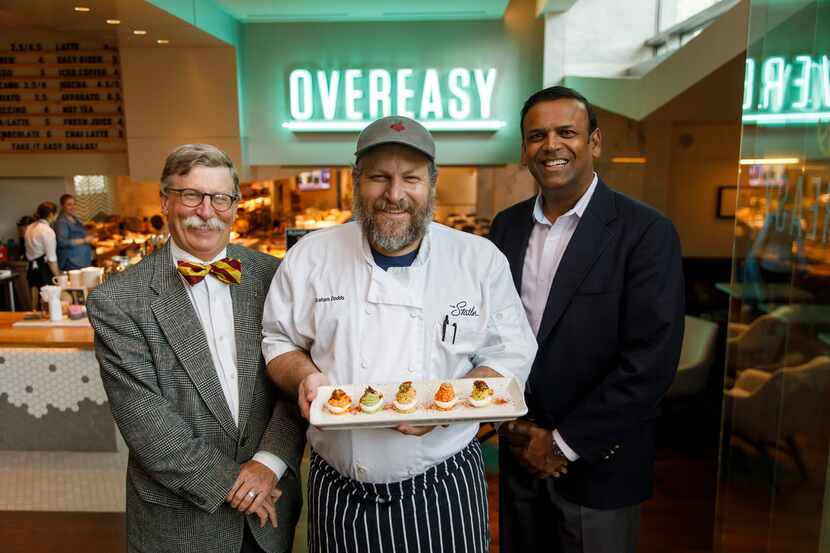 Chef Graham Dodds (center) photographed at his restaurant Overeasy with Bill Holston (left),...