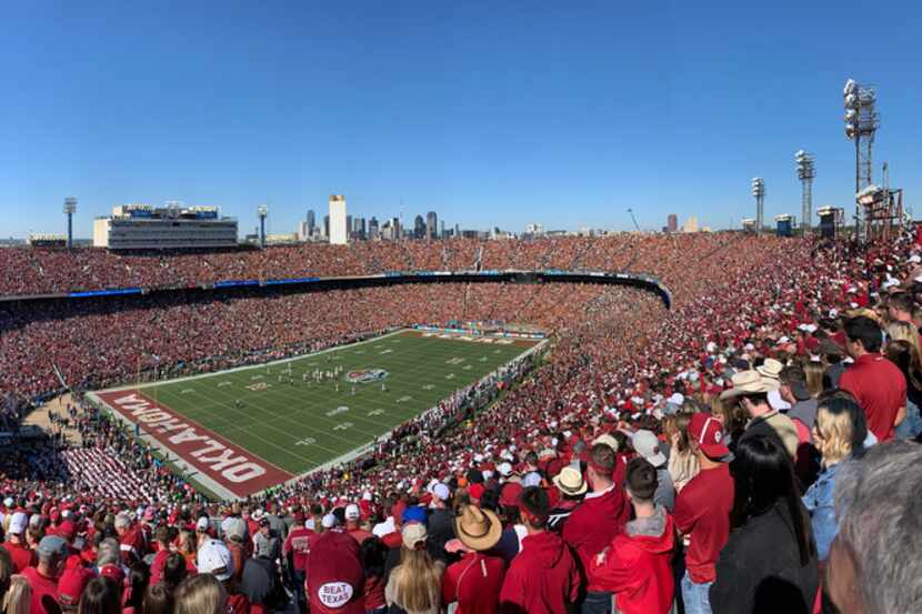 Fans watch as Texas Longhorns and Oklahoma Sooners compete in the opening drive in the Red...