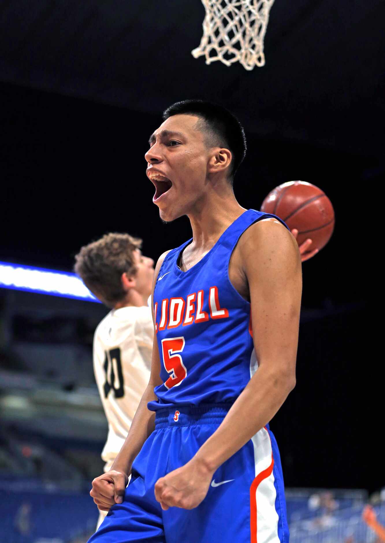 Slidell guard Humberto Hernandez #5 reacts after scoring. Slidell defeated Jayton 45-28 in a...