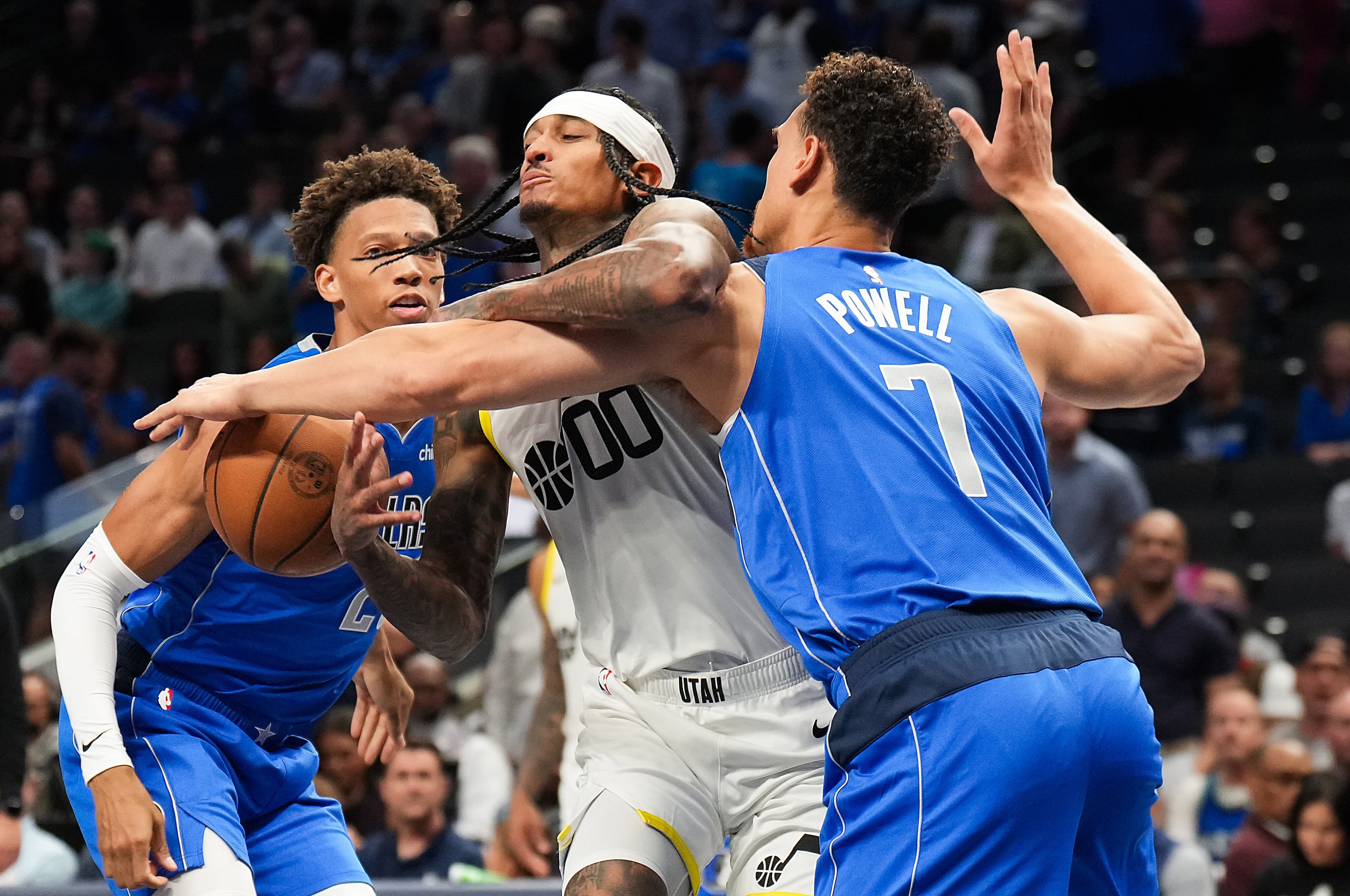 Utah Jazz guard Jordan Clarkson (00) is fouled by Dallas Mavericks center Dwight Powell (7)...