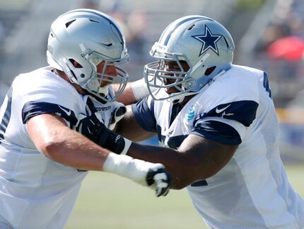 Dallas Cowboys tackle Tyron Smith (77) pushes Dallas Cowboys offensive tackle Dan Skipper...