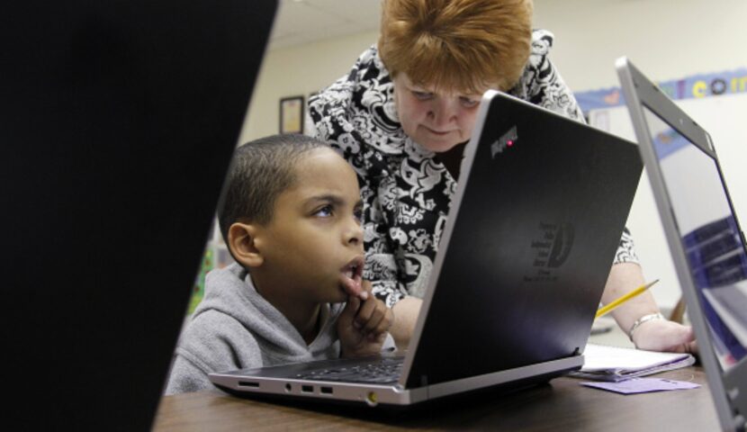 Erma Pruett, a second-grade teacher at Kleberg Elementary School, watched Jaelonn Cox solve...