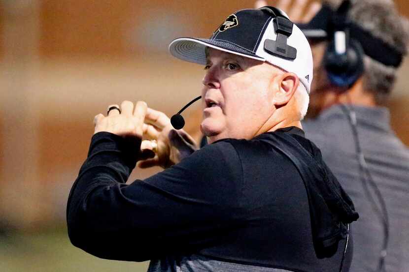 Fossil Ridge High School head coach Tony Baccarini signals from the sideline during the...