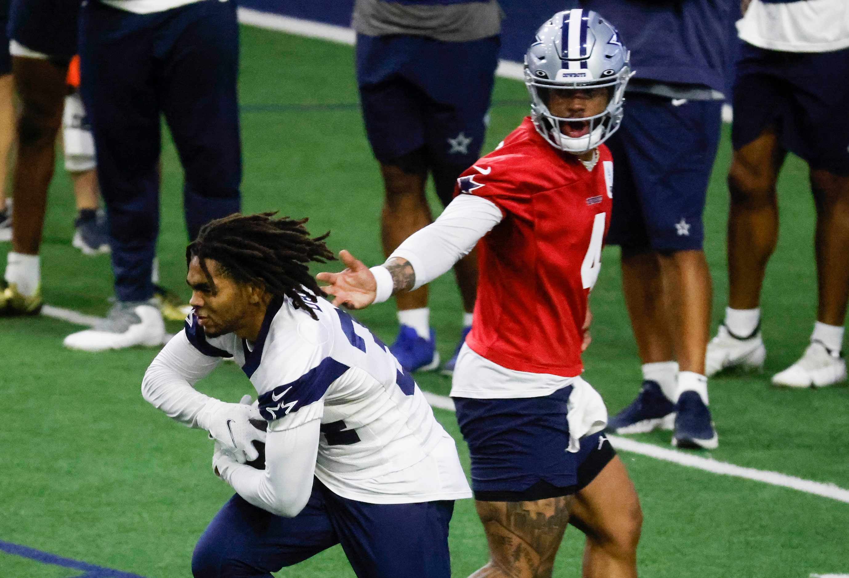 Dallas Cowboys quarterback Dak Prescott (4) hands off the ball to Dallas Cowboys running...