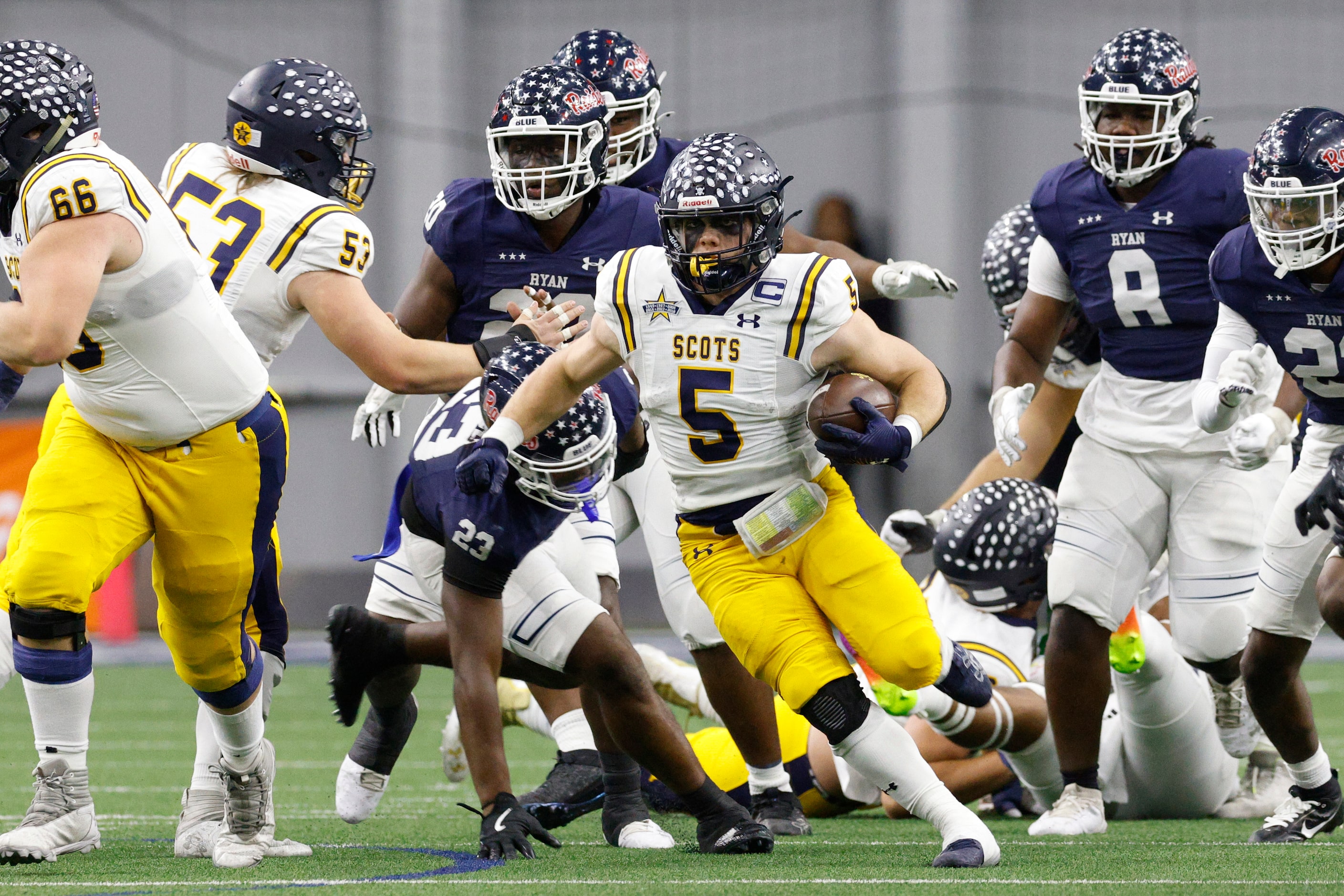 Highland Park running back James Lancaster (5) runs the ball during the first half of a...