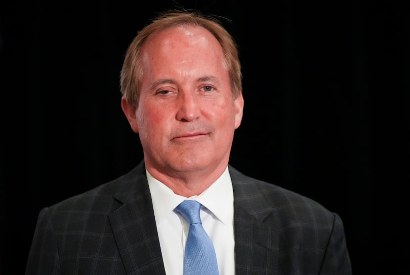 Texas Attorney General Ken Paxton chats with supporters during a primary election night...