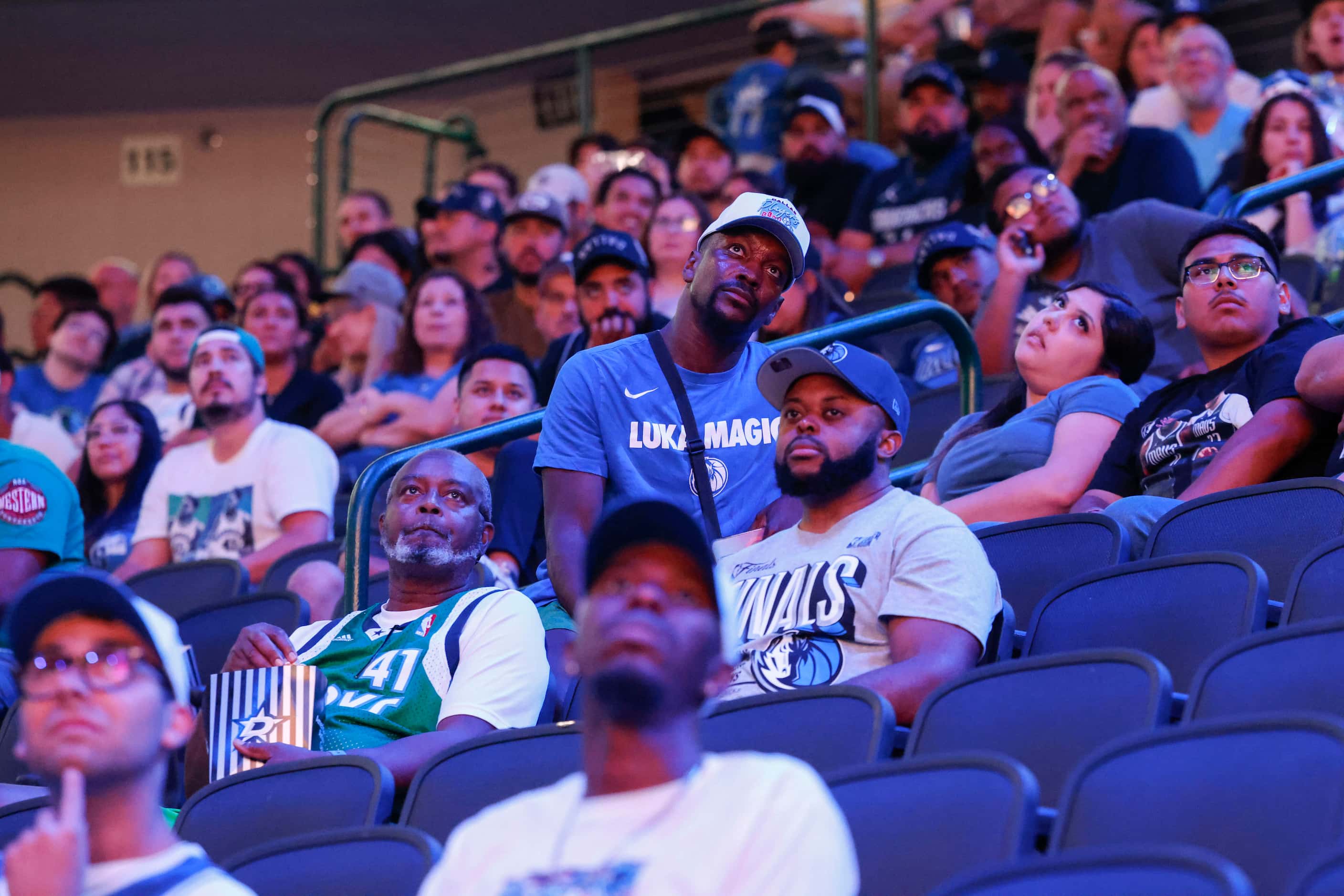 Dallas Mavericks fans look dejected in a watch party followed by the teams’ defeat in the...