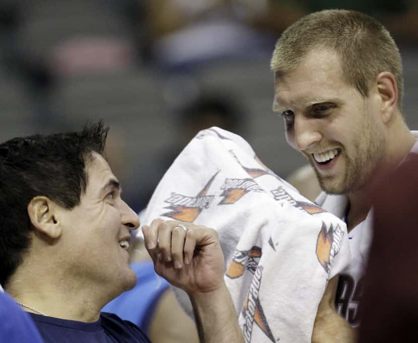 In this Oct. 7, 2008, file photo, Dallas Mavericks owner Mark Cuban, left, laughs with...