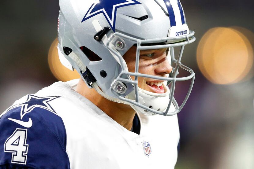 Dallas Cowboys quarterback Dak Prescott (4) flashes a smile as he prepares to face the...