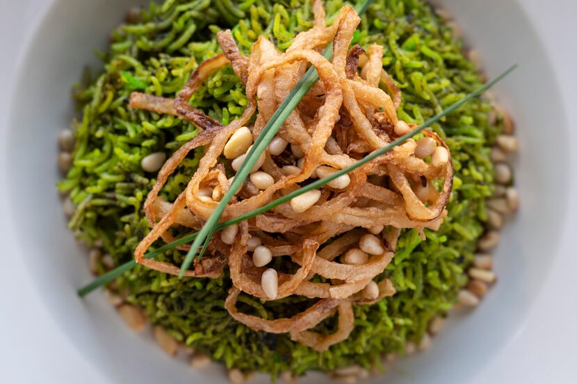 Emerald Pilaf is a vegan rice dish with pine nuts at Âme in the Bishop Arts District.