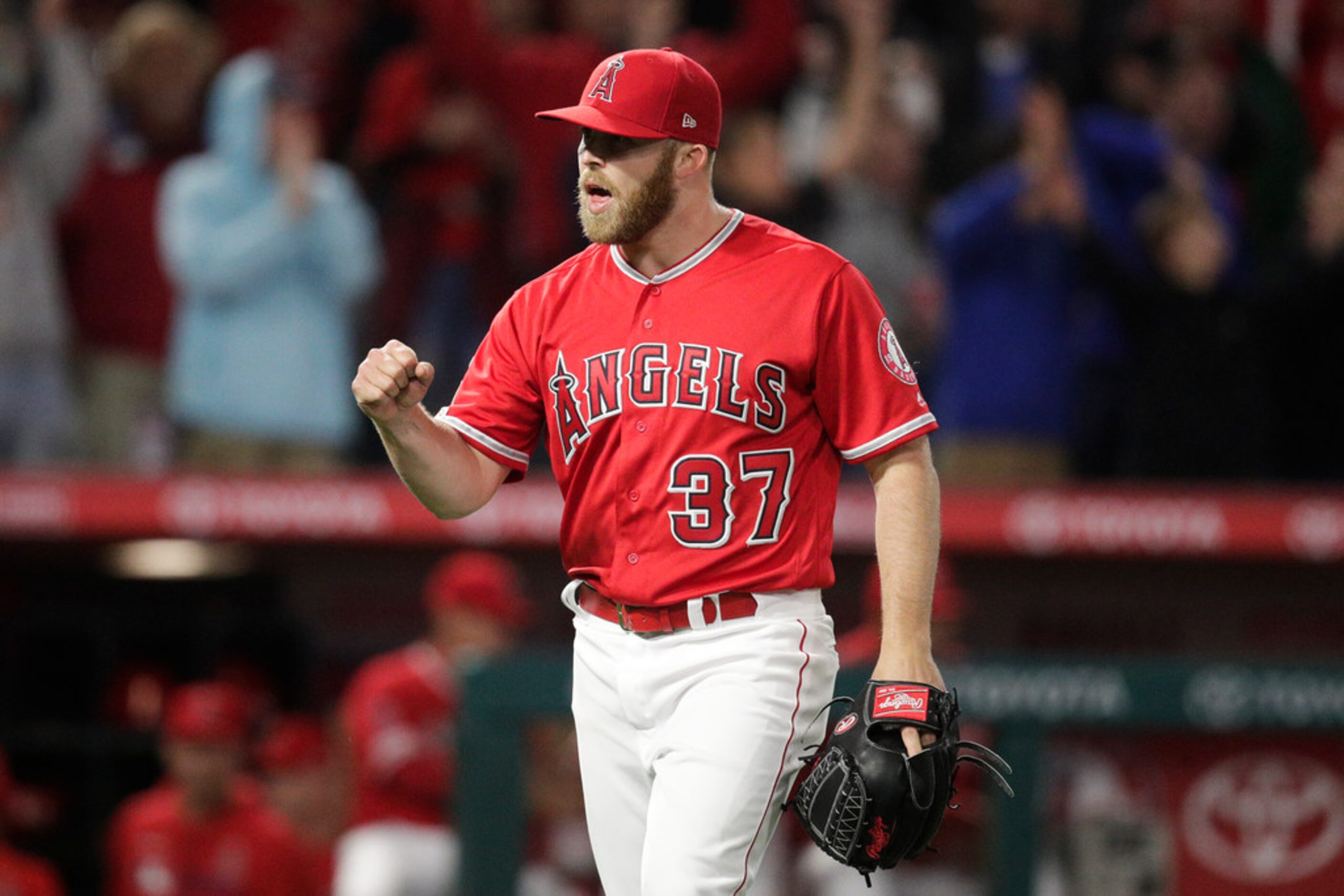 Los Angeles Angels relief pitcher Cody Allen celebrates the team's 3-1 win against the Texas...