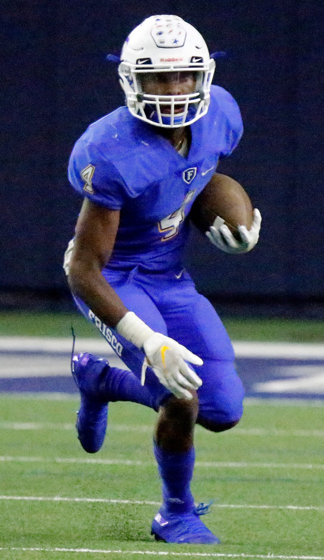 Frisco High School wide receiver Chase Lowery (4) runs the football after the catch during...