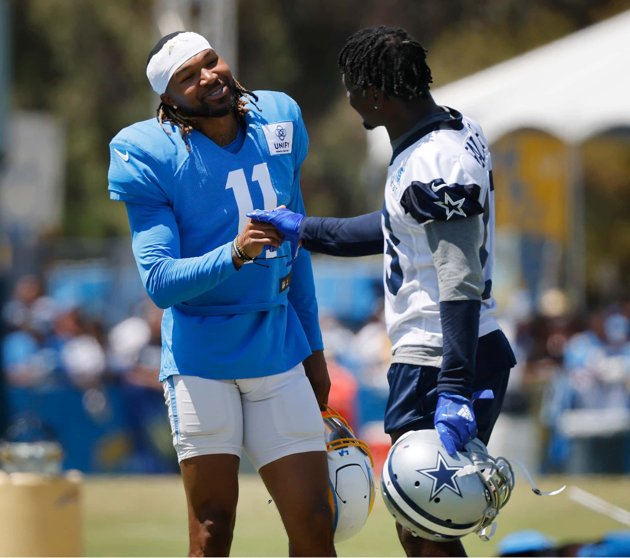 Dallas Cowboys wide receiver Michael Gallup (13) is greeted by Los Angeles Chargers wide...