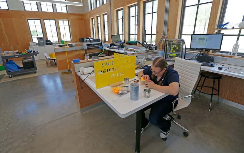 Danielle Webber works on a project inside the Walsh Makerspace in the Walsh development in...