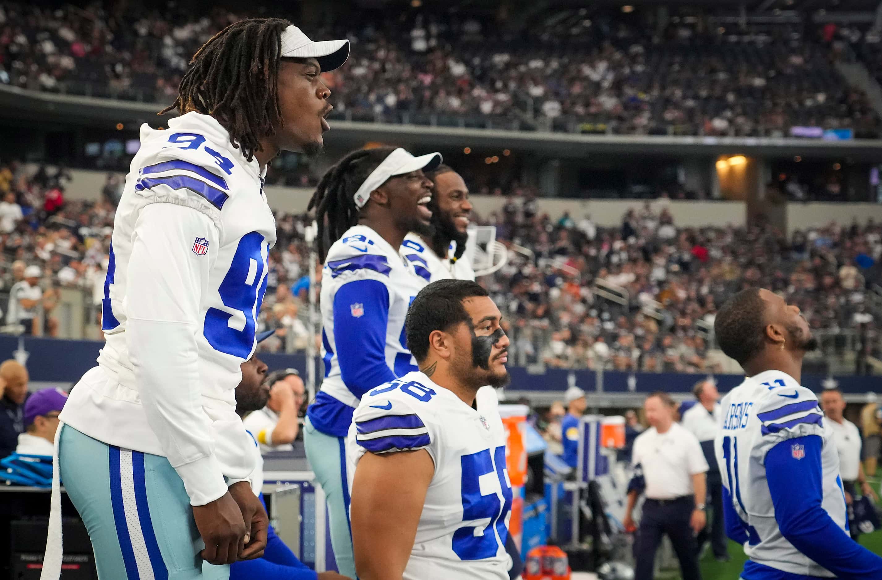 Dallas Cowboys defensive end Randy Gregory (94) cheers from the bench during the first half...