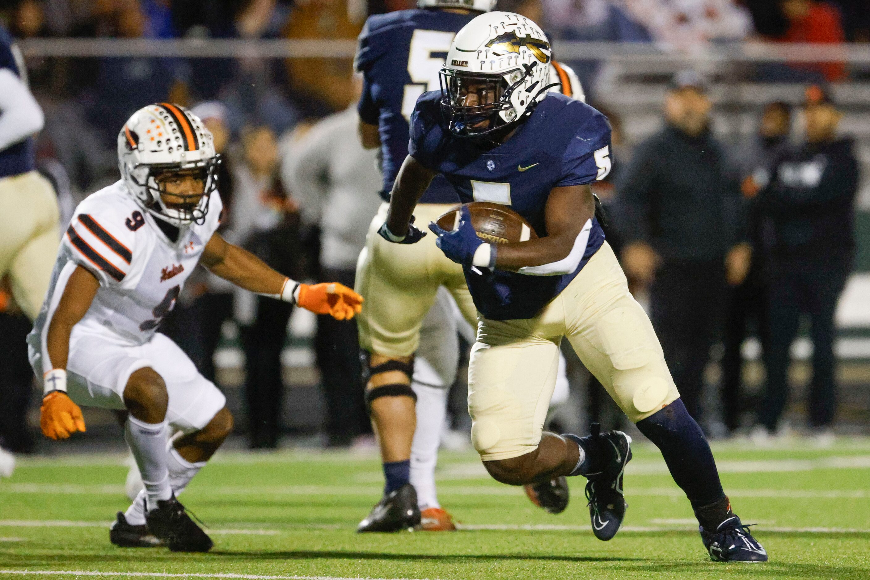 Keller high’s Cameron Rayford (5) runs the ball for a touchdown past Haltom High’s Xavier...