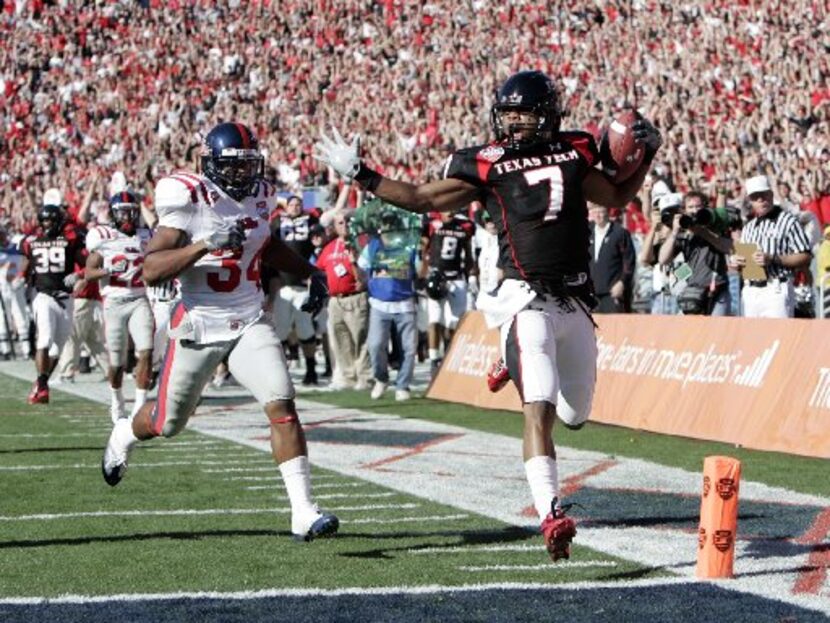  Texas Tech's Darcel McBath (7) runs in for a touchdown off an interception with Ole Miss'...