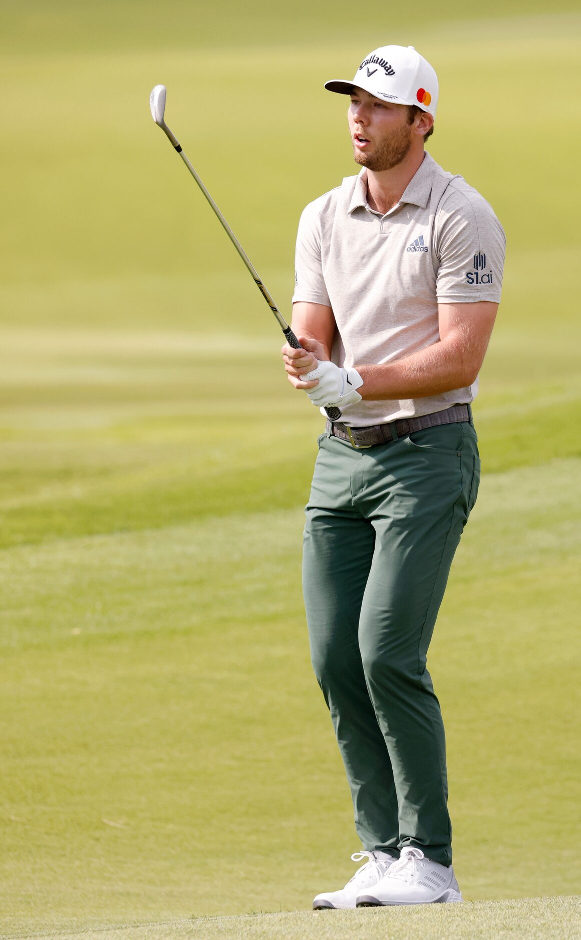 Sam Burns reacts after barely missing a putt for a birdie on the 16th hole during round 3 of...