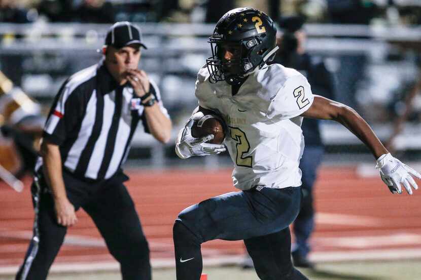 The Colony junior running back Myles Price (2) carries a pass for a touchdown as during the...