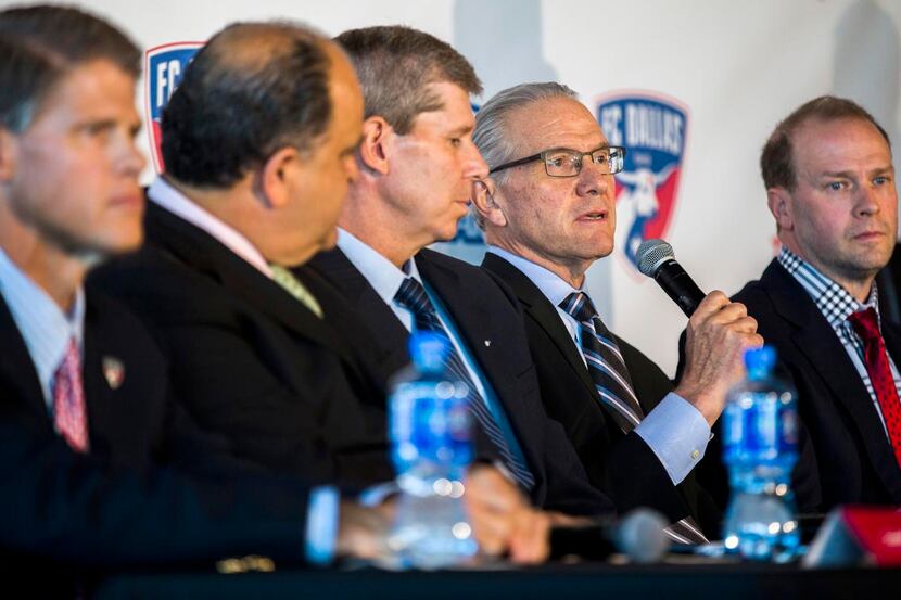 
U.S. Soccer CEO and Secretary General Dan Flynn (second from right) answers media questions...