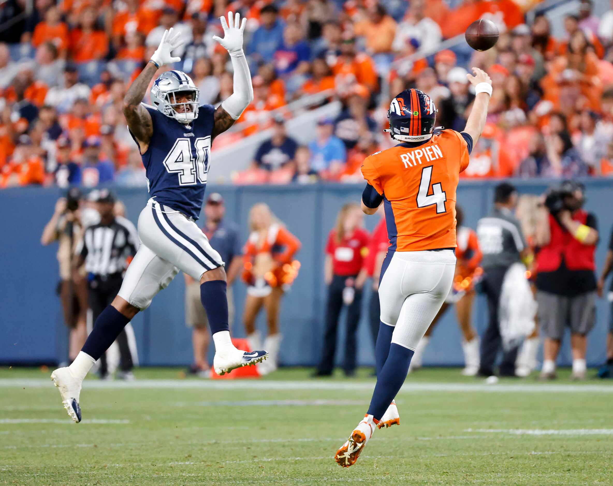 Dallas Cowboys safety Juanyeh Thomas (40) makes a leaping stab at a Denver Broncos...