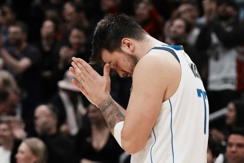 Dallas Mavericks' Luka Doncic reacts after a turnover in possession with seconds left on the...