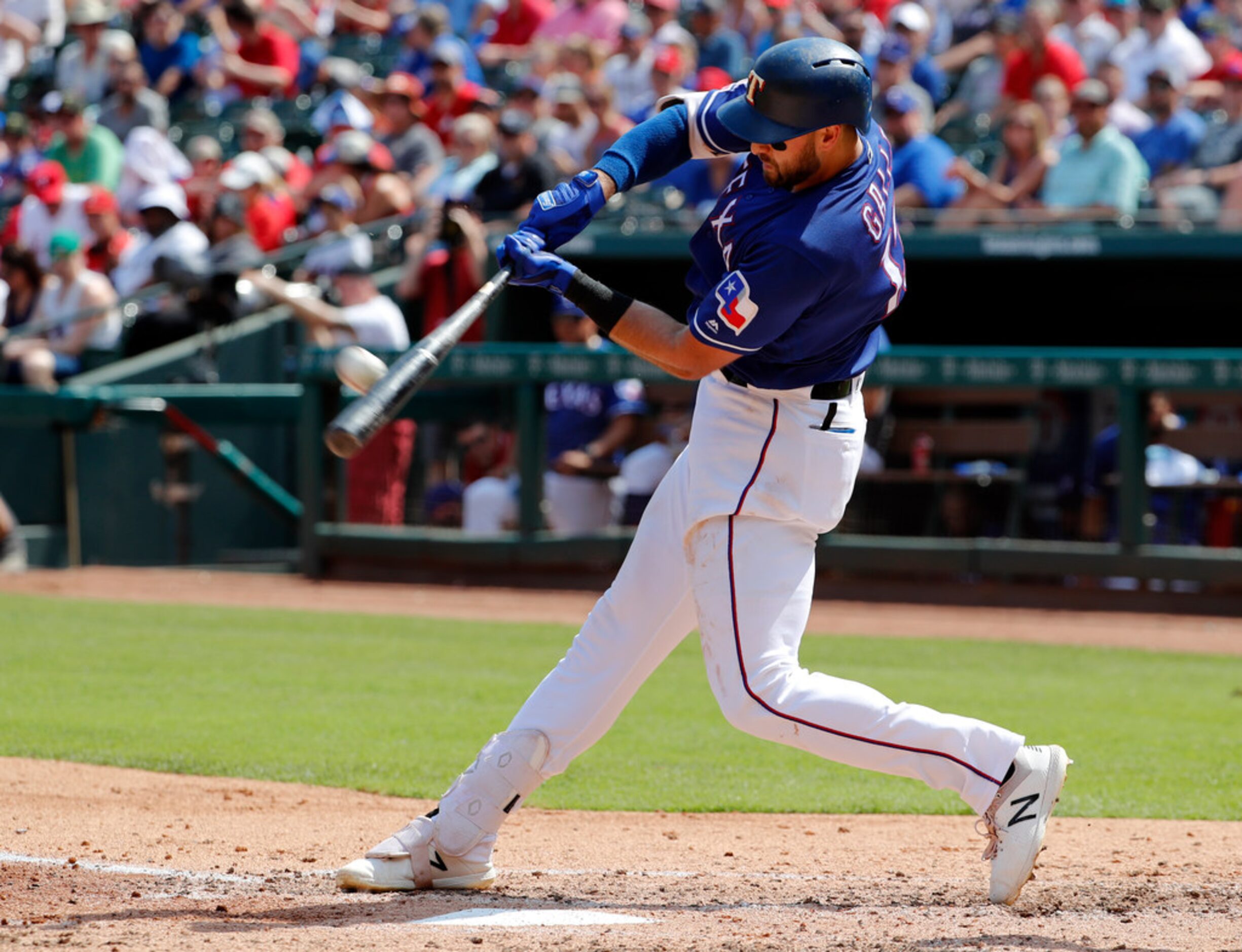 Texas Rangers' Joey Gallo connects for a two-run home run on a pitch from Kansas City...