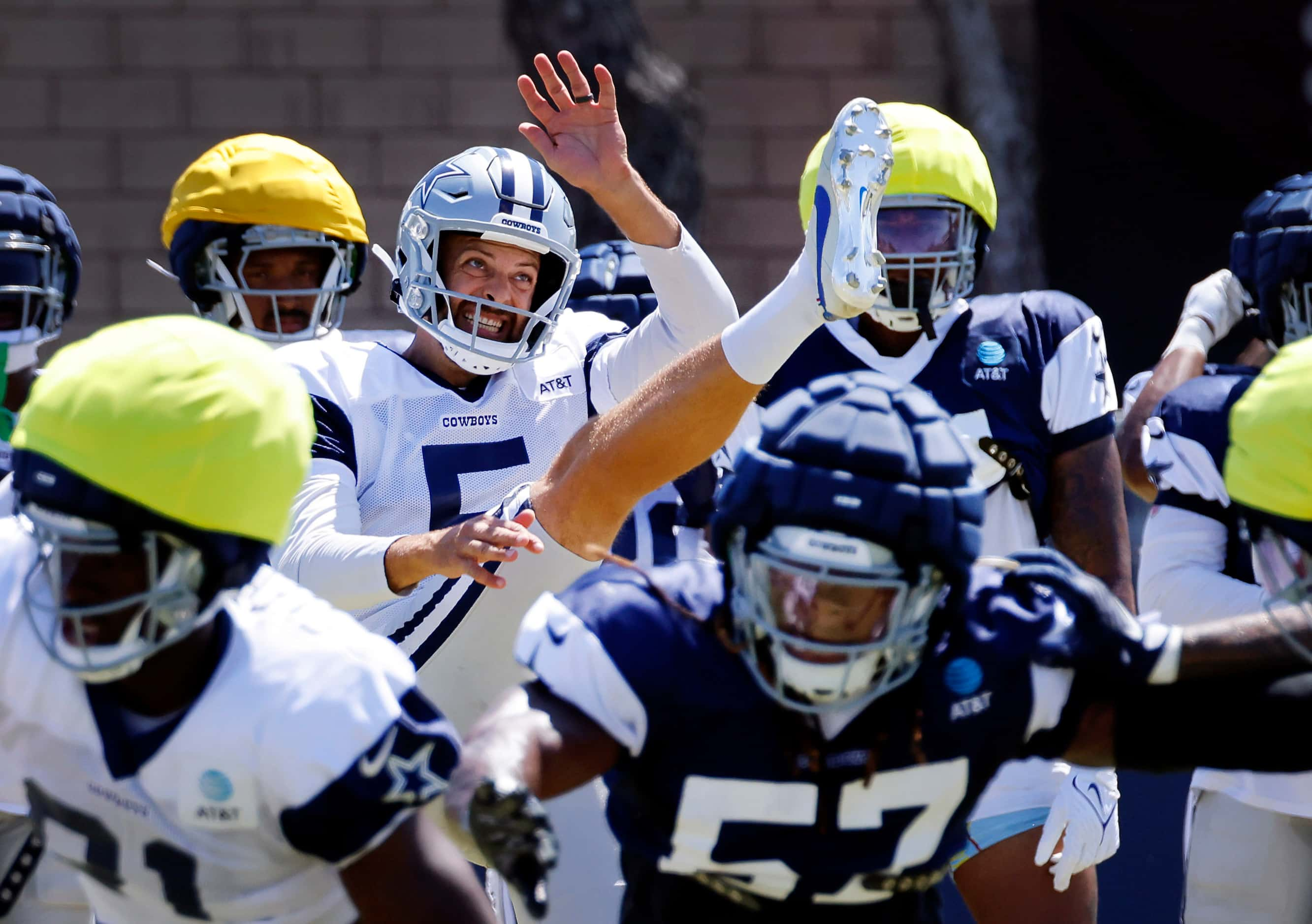 Dallas Cowboys punter Bryan Anger (5) kicks the ball during special teams plays at training...