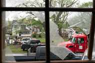 A view from a residence home in Westmoreland, crews clean up the debris on Wednesday, May 1,...