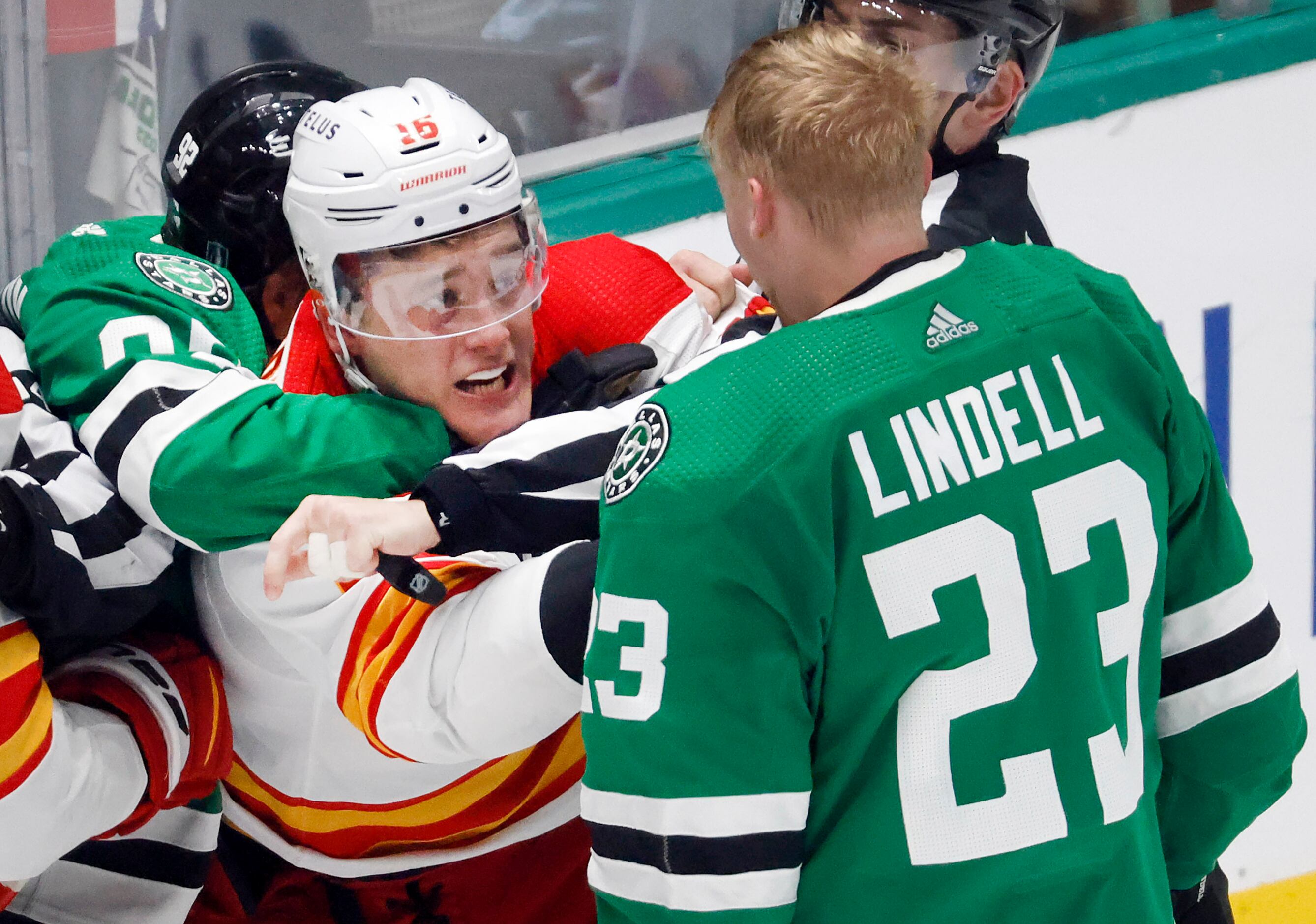 Dallas Stars center Vladislav Namestnikov (92) holds back Calgary Flames defenseman Nikita...