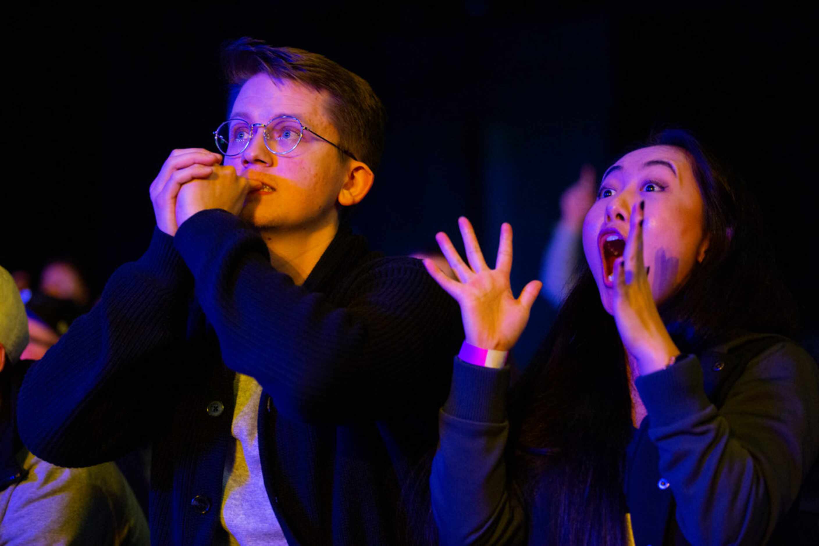 Oscar Vallner (left) and Daisy Wang from Dallas hold their breath as the Dallas Fuel leads...