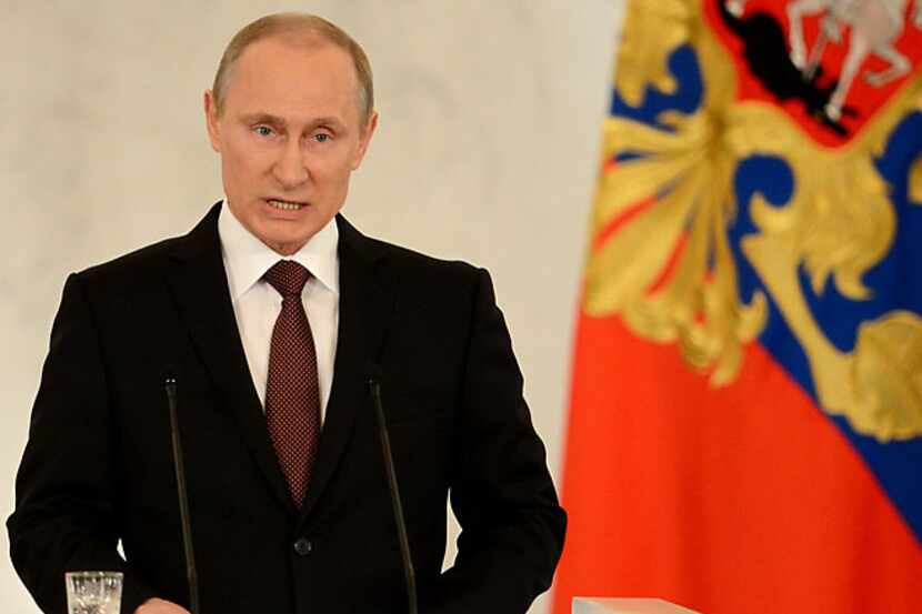 Russia's President Vladimir Putin addresses a joint session of Russian parliament on Crimea...
