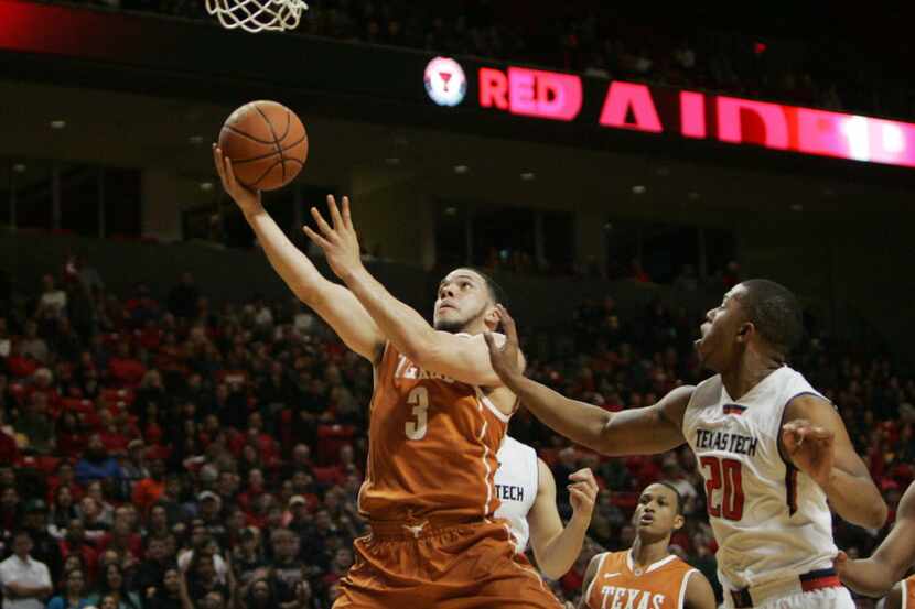 Mar 8, 2014; Lubbock, TX, USA; Texas guard Javan Felix (3) drives to the basket against...