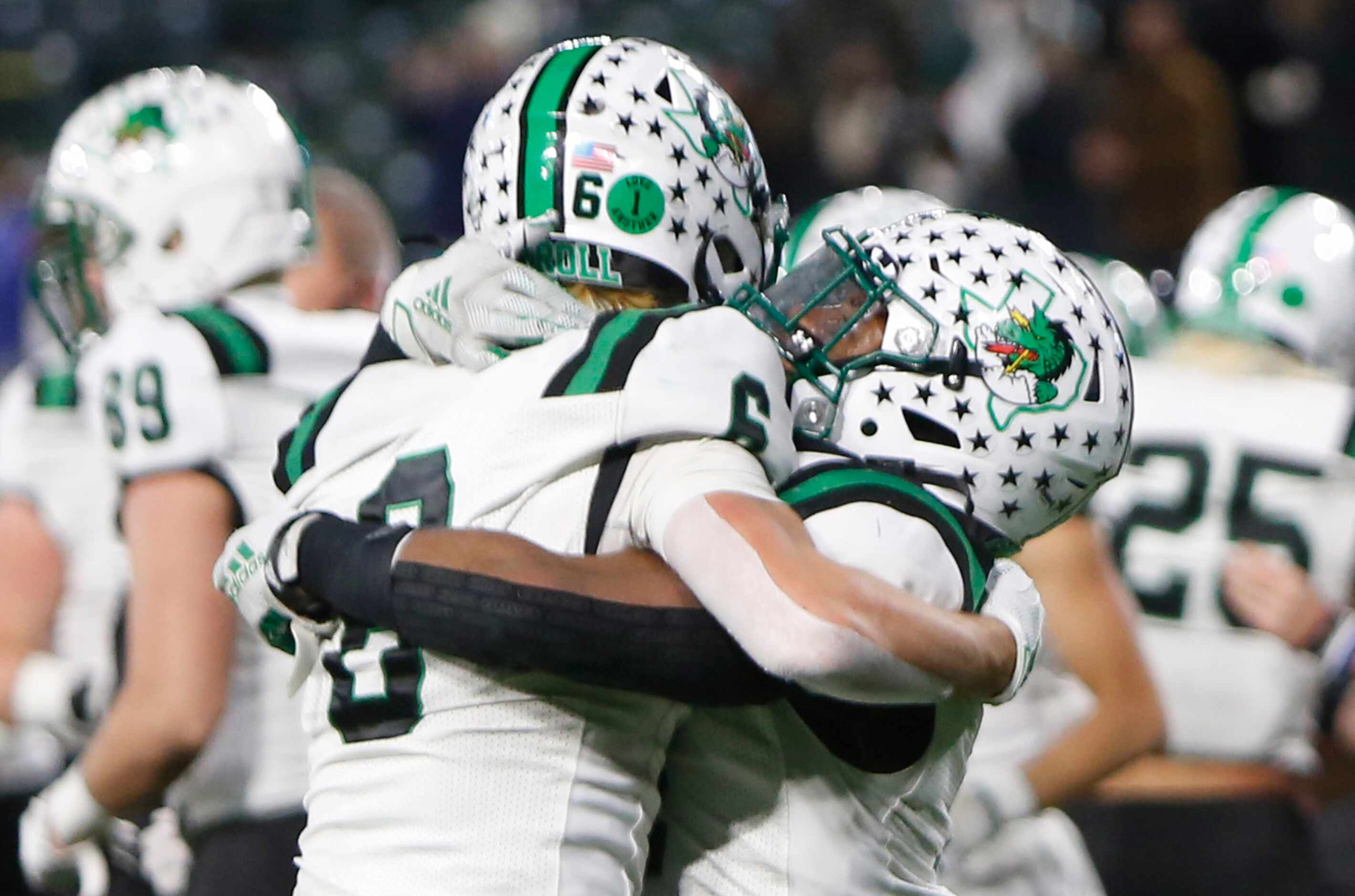 Southlake Dragons players Landon Samson (6), left, and Cinque Williams (4) celebrate the...
