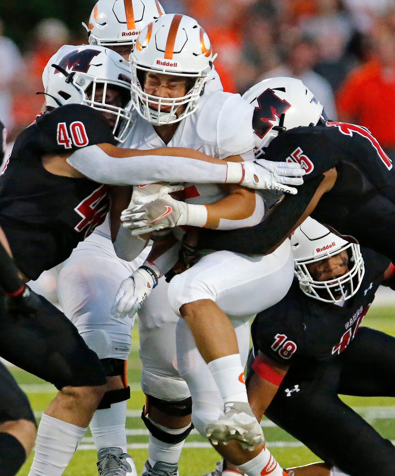 Celina High School running back Trae Hollins (5) is met by Melissa High School outside...