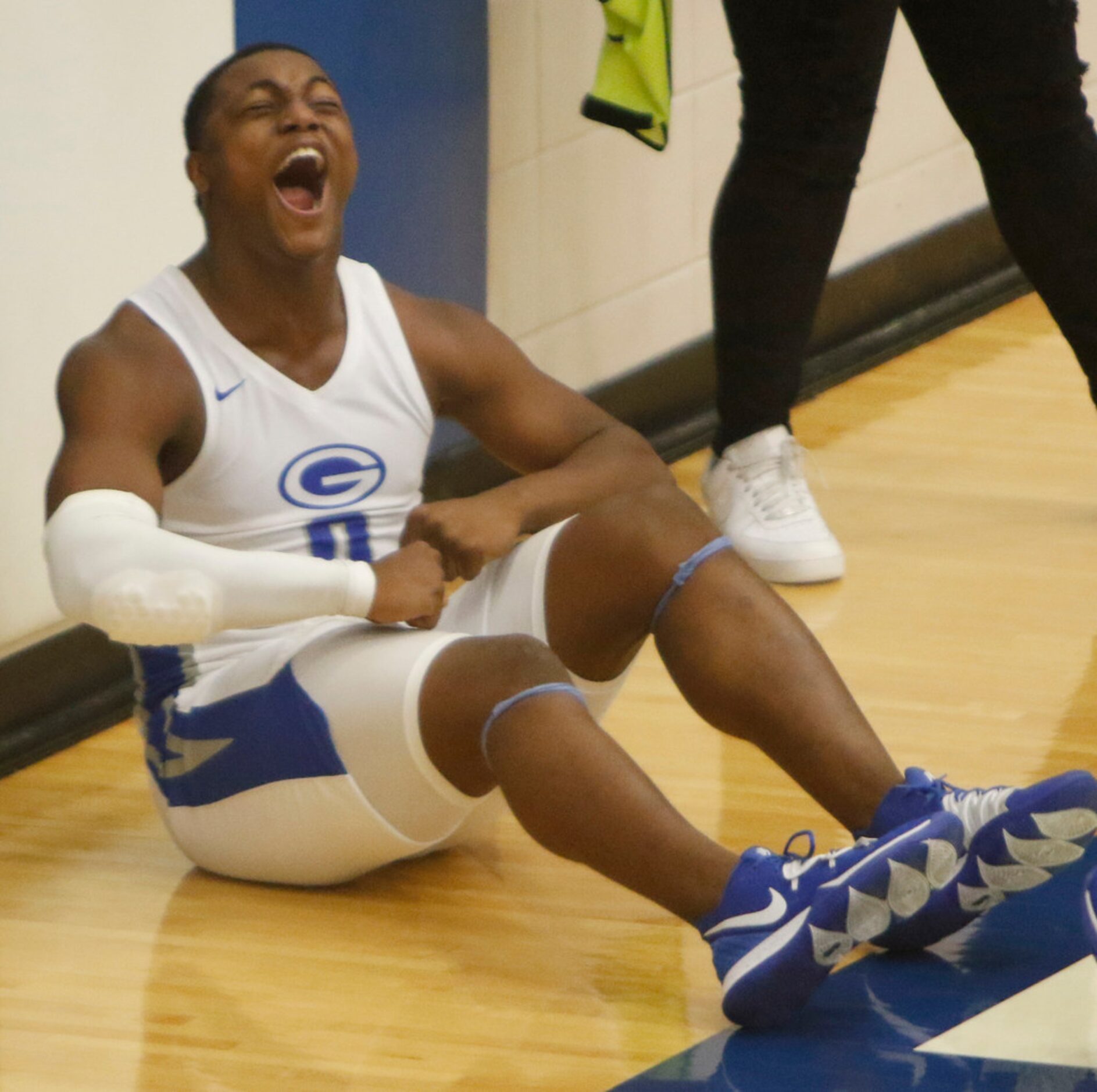 Grand Prairie's Savion Red (0) lets out a yell after scoring following a steal during the...