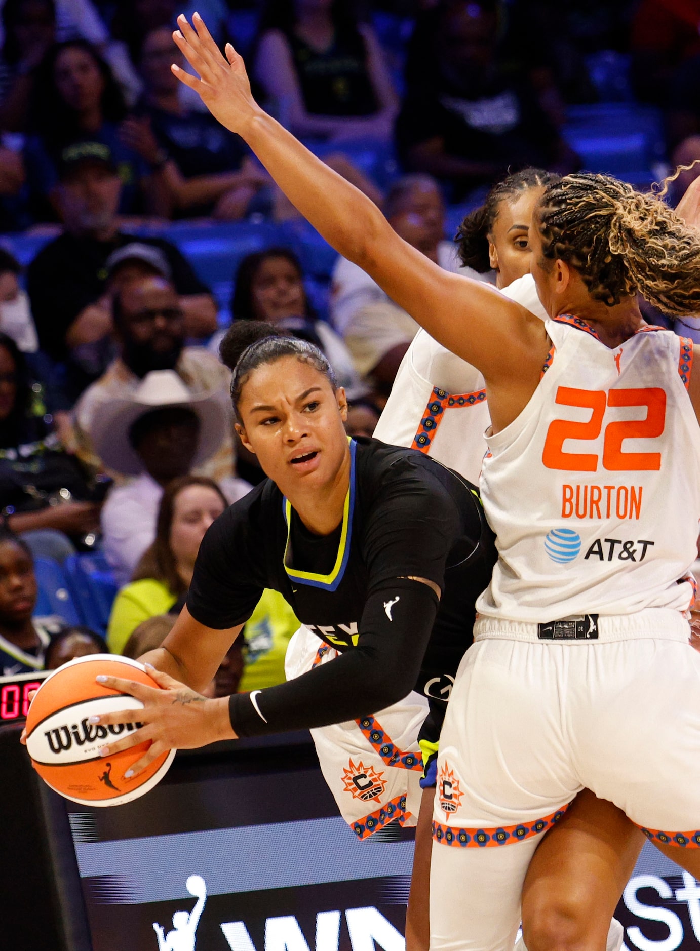 Dallas Wings forward Satou Sabally (0) looks to pass against Connecticut Sun guard Veronica...