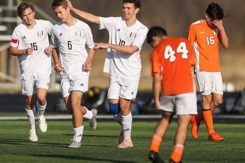 Lovejoy's Max Pabin (16), Tyler Loop (6) and Haydn Spooner (19) celebrate a goal as...