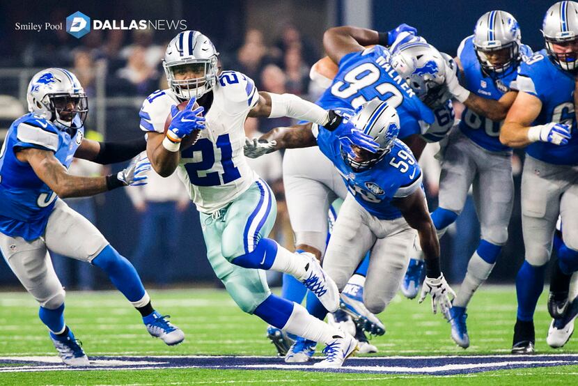 Dallas Cowboys running back Ezekiel Elliott (21) breaks through the Detroit Lions defense on...