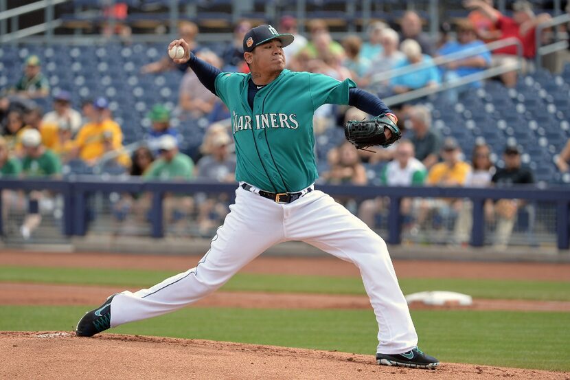 PEORIA, AZ - MARCH 05: Felix Hernandez #34 of the Seattle Mariners delivers a pitch in the...