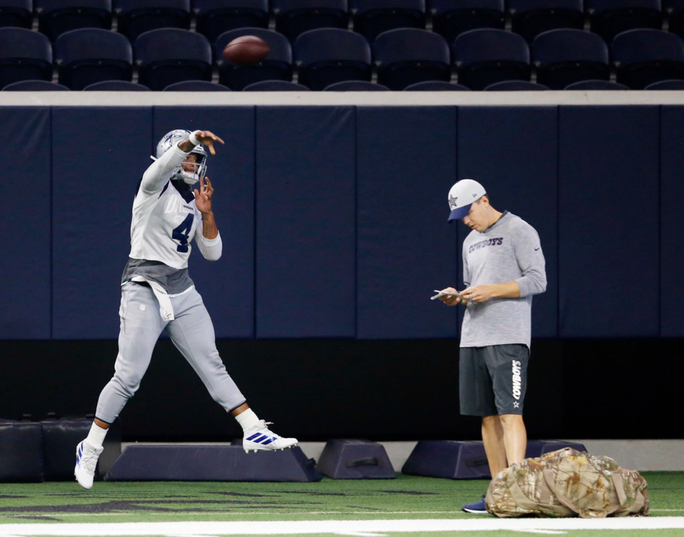 Dallas Cowboys quarterback Dak Prescott (4) makes a throw in front of Dallas Cowboys...