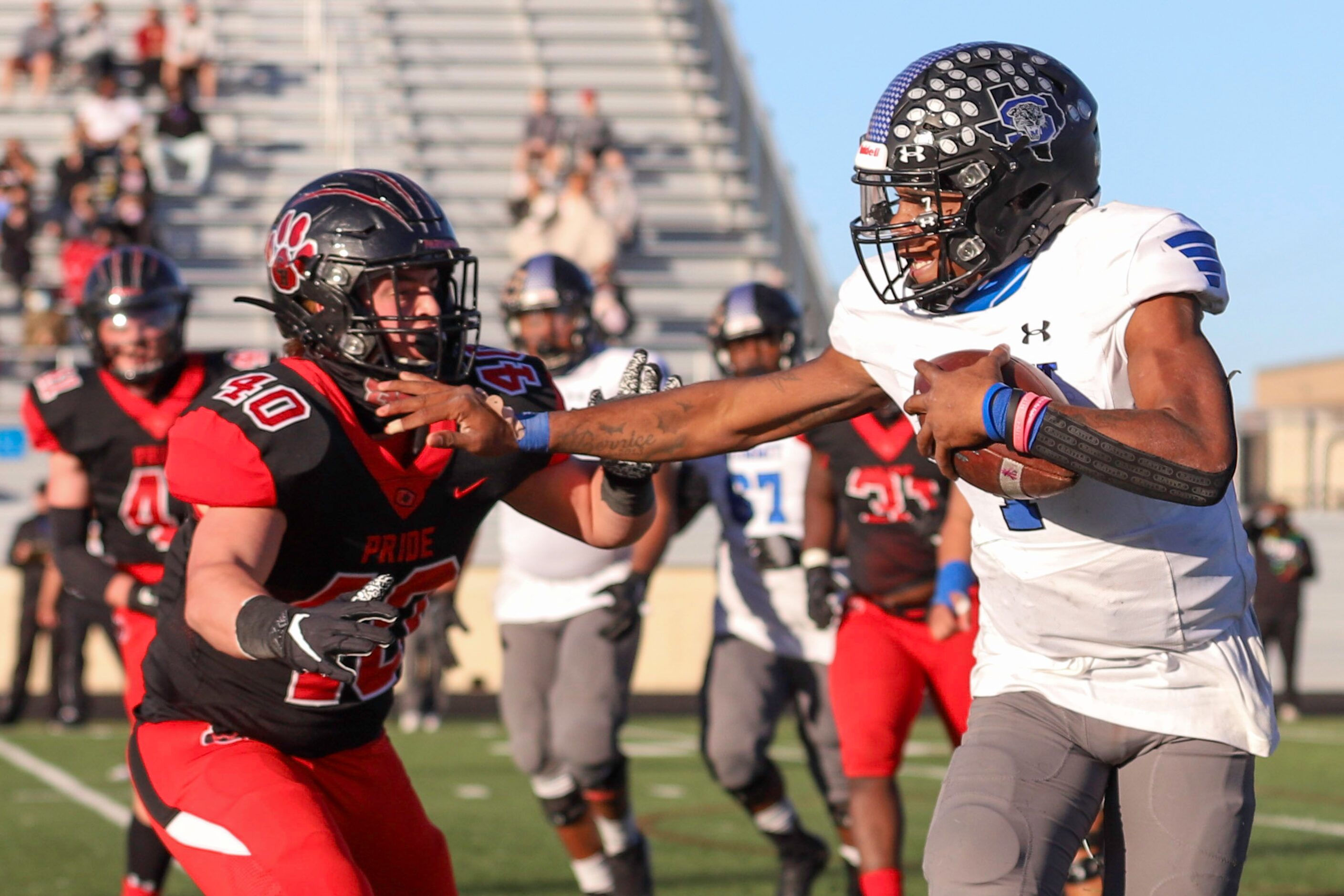 Mansfield Summit quarterback David Hopkins (7) blocks Colleyville Heritage linebacker Quinn...