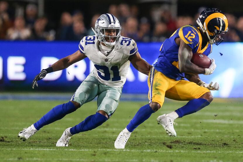 Dallas Cowboys cornerback Byron Jones (31) works to stop Los Angeles Rams wide receiver...