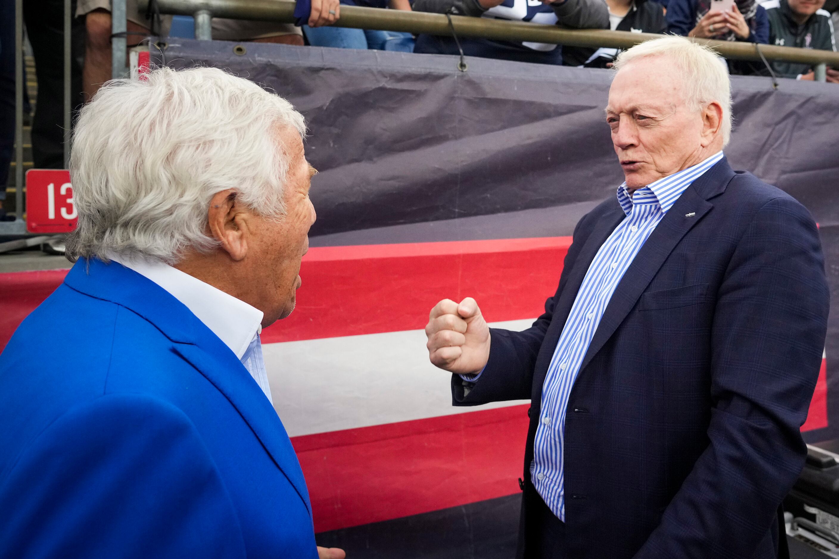 Dallas Cowboys owner and general manager Jerry Jones laughs with New England Patriots owner...