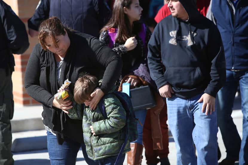 Parents pick up their children at Stafford Elementary school after a shooting at Italy High...