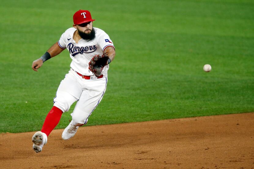 Texas Rangers second baseman Rougned Odor (12) fields a ball hit by Seattle Mariners Austin...
