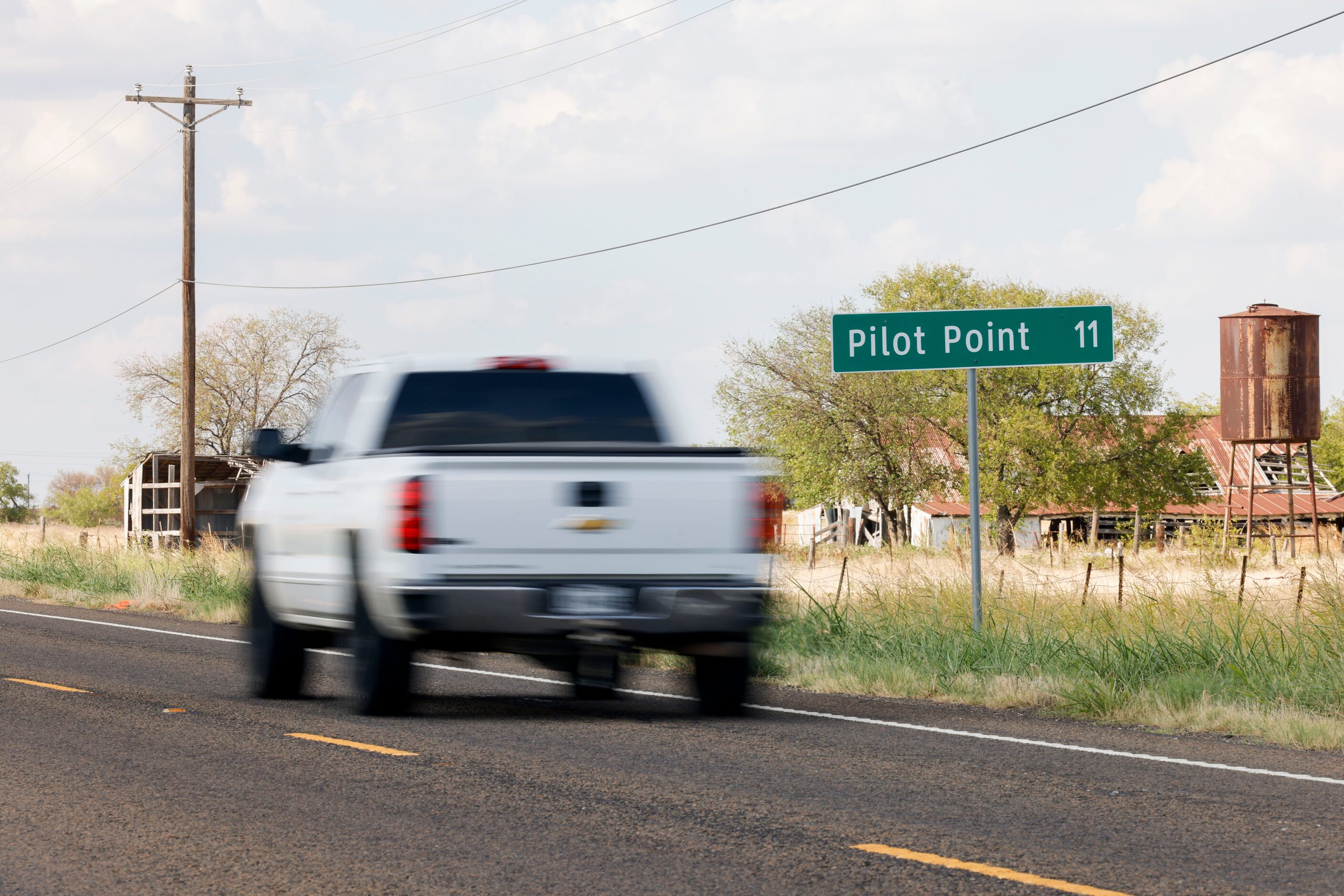 A truck drives along FM 1385 in Pilot Point.