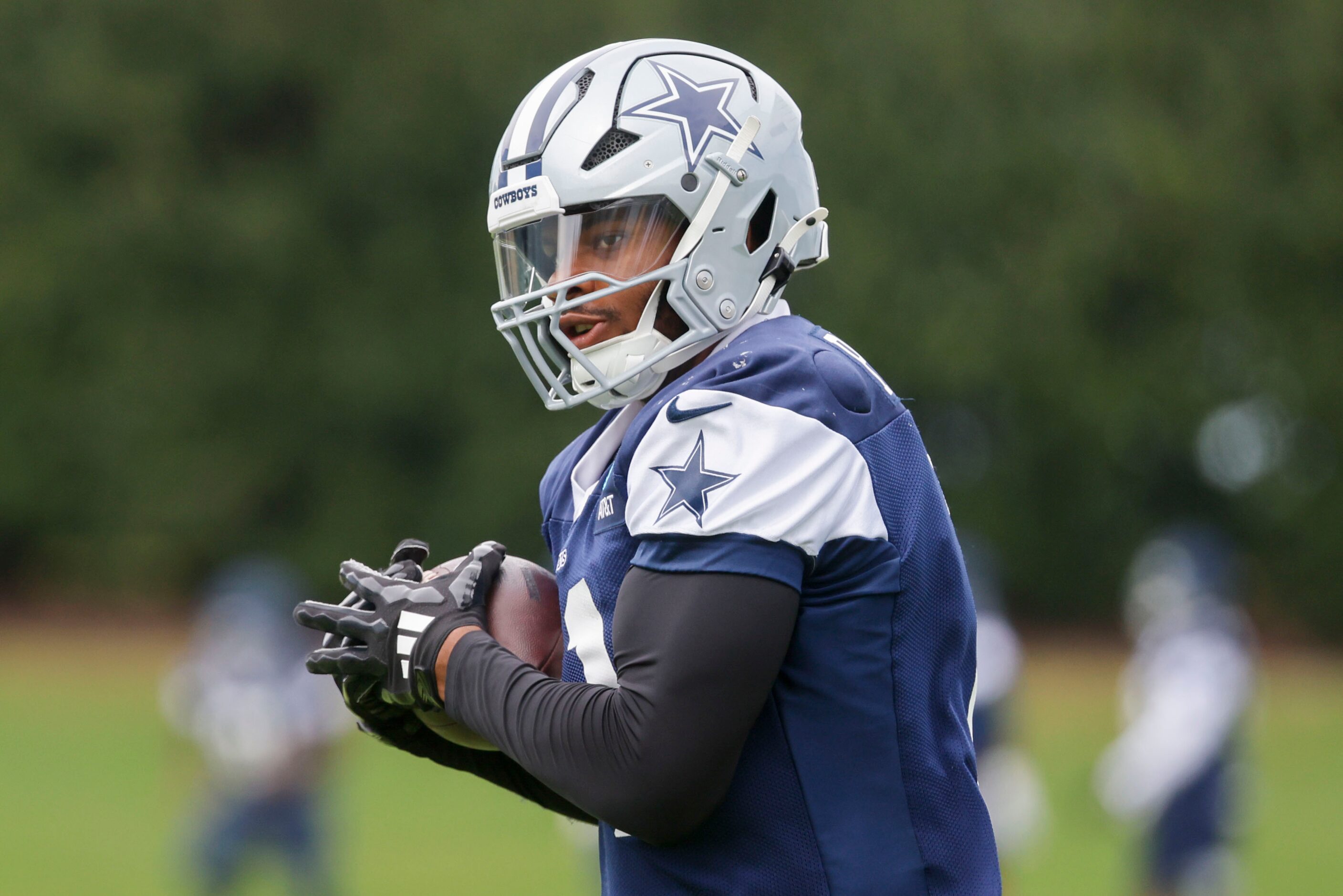 Dallas Cowboys linebacker Micah Parsons (11) receives a pass during a team practice, on...